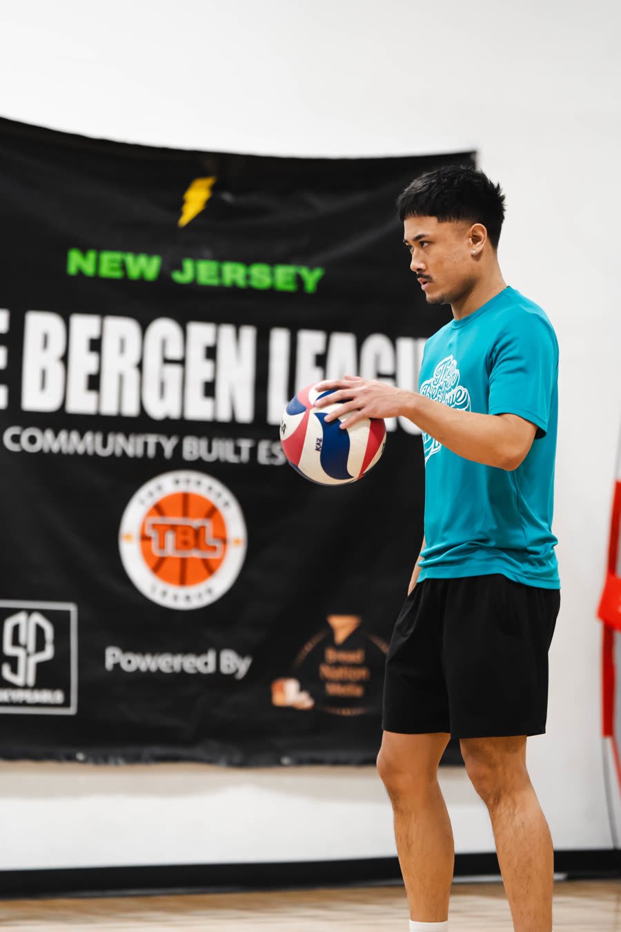 Player in front of the Community Built league banner