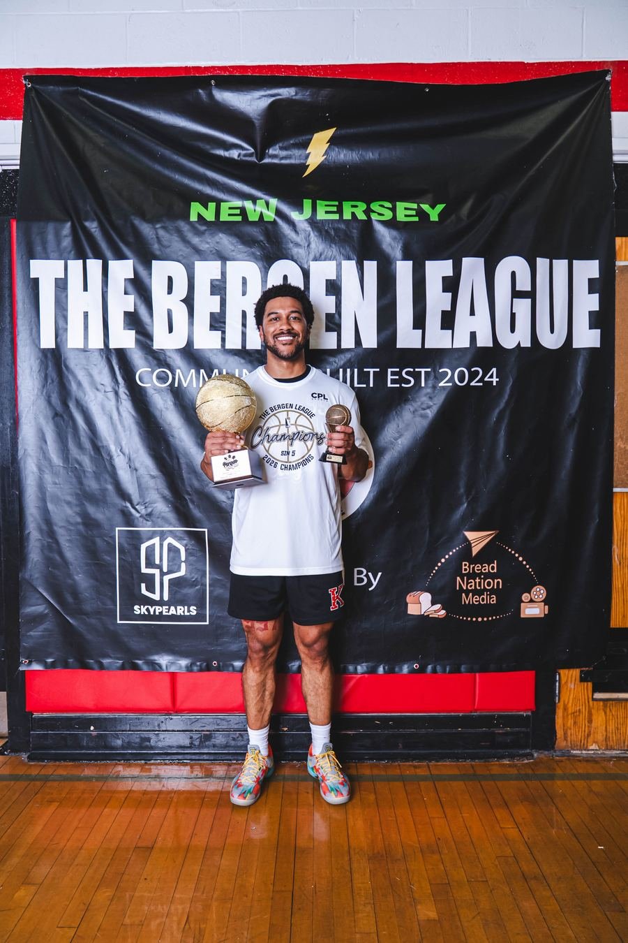 Season 5 champion with trophies at the league banner