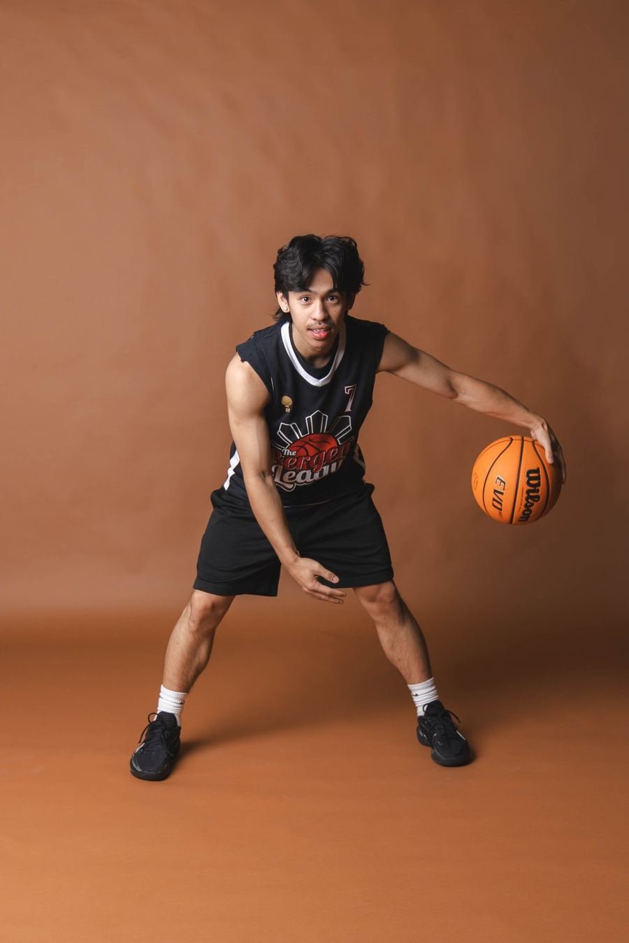 Player mid-crossover, studio portrait
