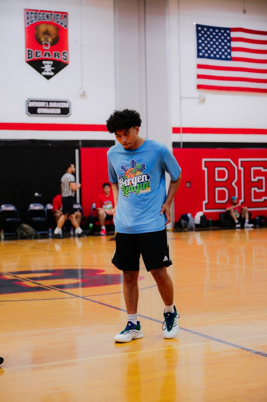 Player in blue surveying the floor